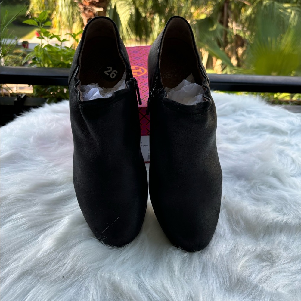 DANSKO ankle black leather boots. A little elasticized top so not so tight.